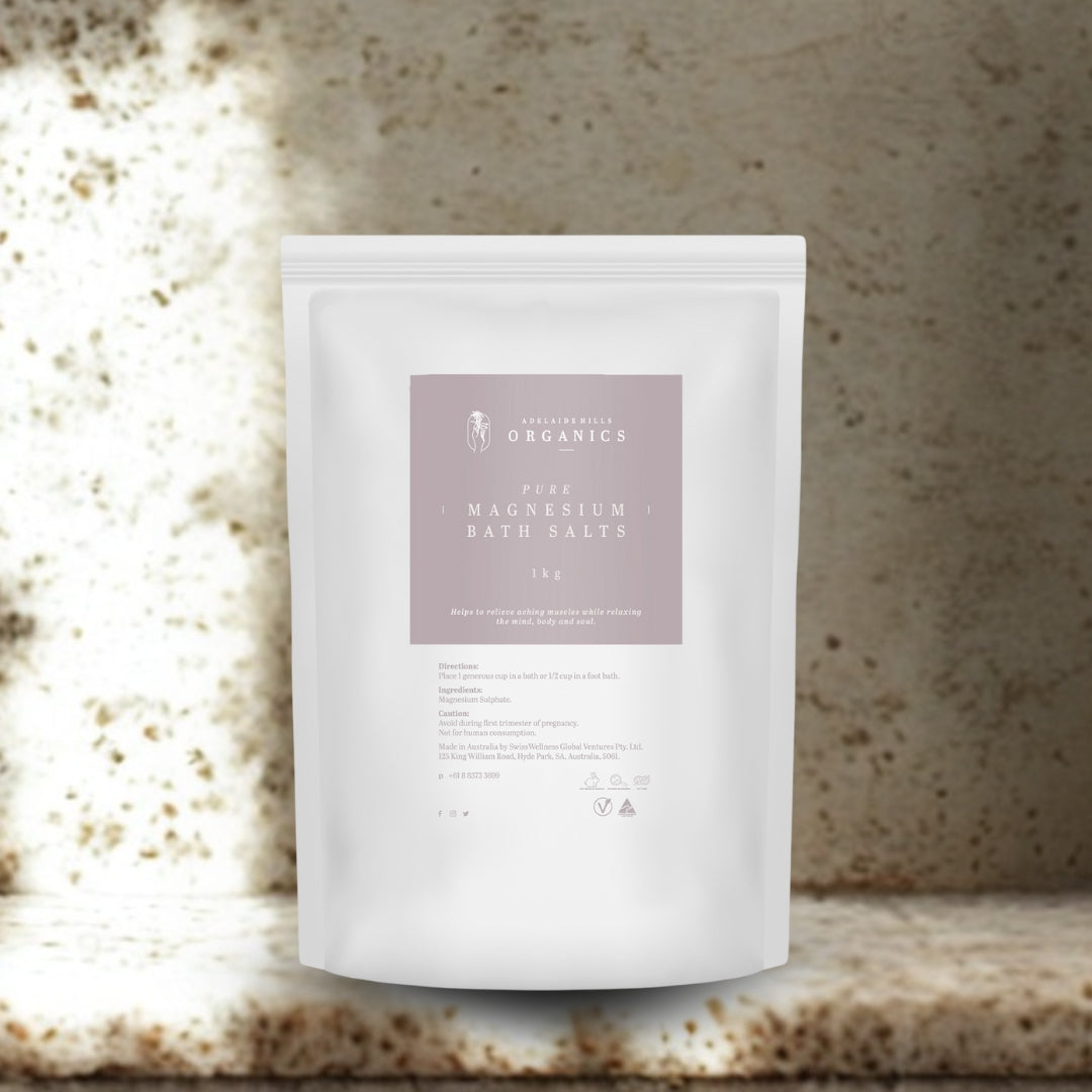 Pure Magnesium Bath Salts 1kg pouch on a stone bench in warm natural light