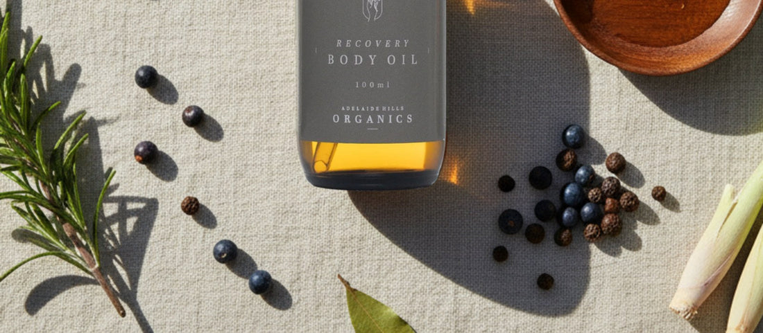 Recovery Body Oil with rosemary and juniper on linen