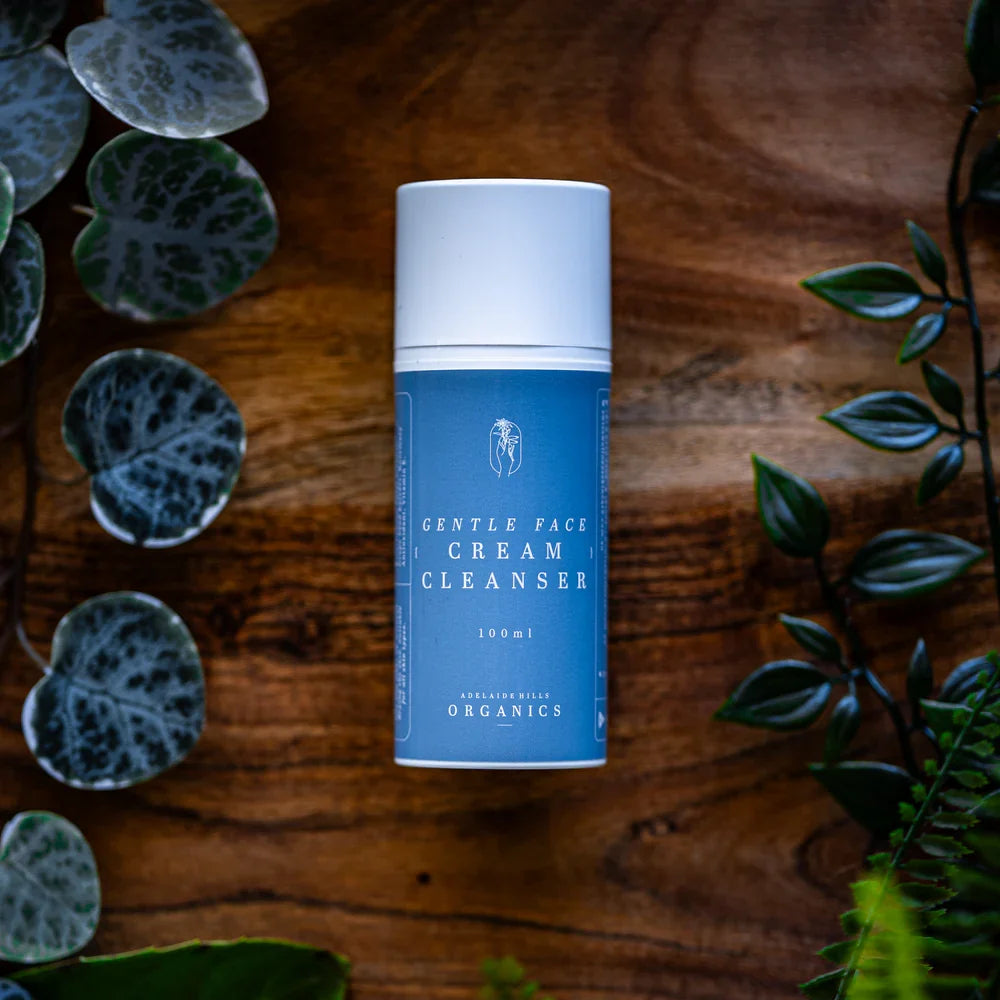 Gentle Face Cream Cleanser on a timber board with fresh greenery - Adelaide Hills Organics