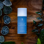 Gentle Face Cream Cleanser on a timber board with fresh greenery - Adelaide Hills Organics