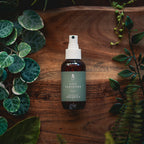 Hand Sanitiser 100ml on a timber board with fresh greenery - Adelaide Hills Organics