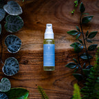 Organic Hemp Seed Oil 25ml on a timber board with fresh greenery - Adelaide Hills Organics