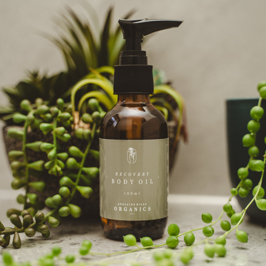 Recovery Body Oil 100ml among green foliage - Adelaide Hills Organics